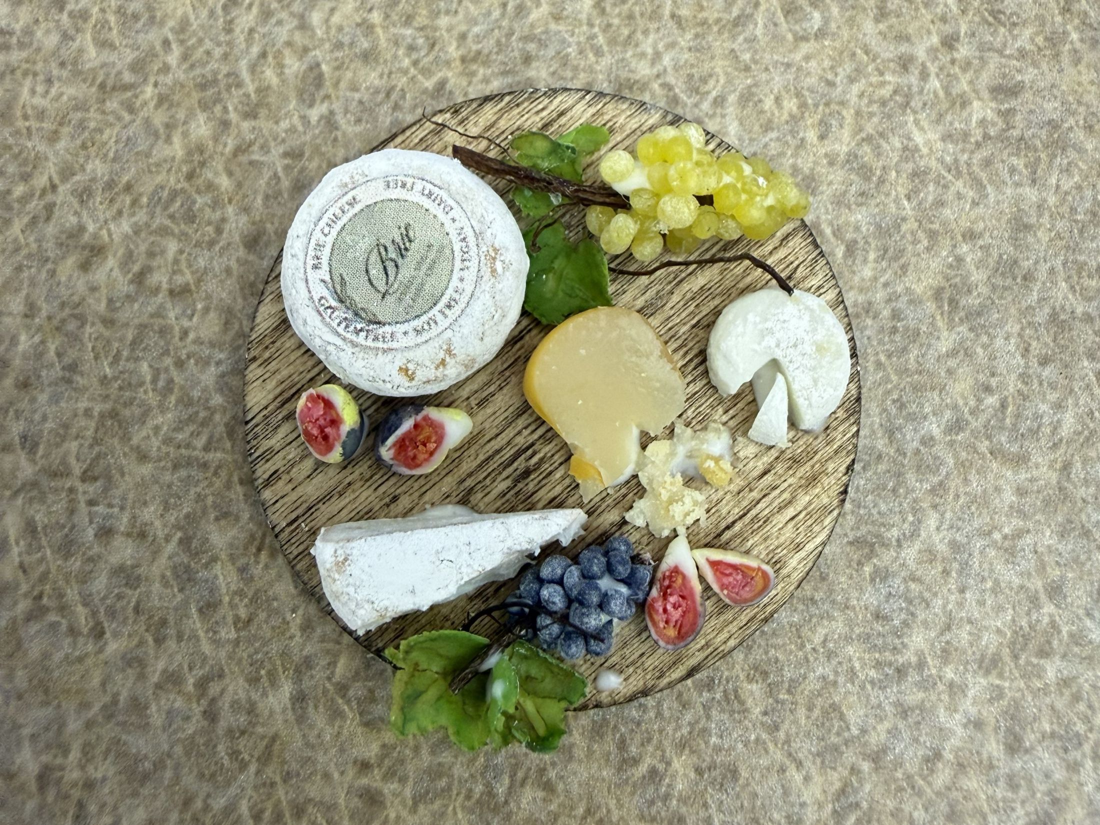 Polymer clay cheese and fruit board created by Sophia Perdikaris under the instruction of Anna Wybranowska