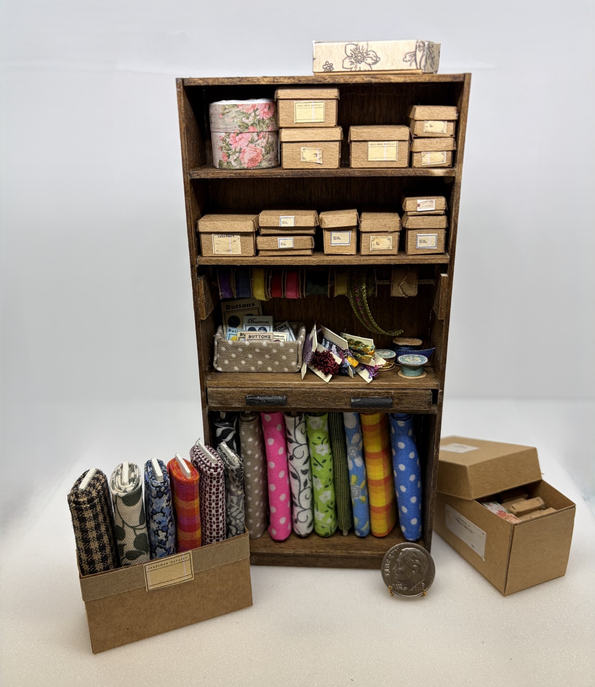 Haberdashery cabinet miniature created by Linda Kohlstaedt under the instruction of IGMA fellow Pat Richards